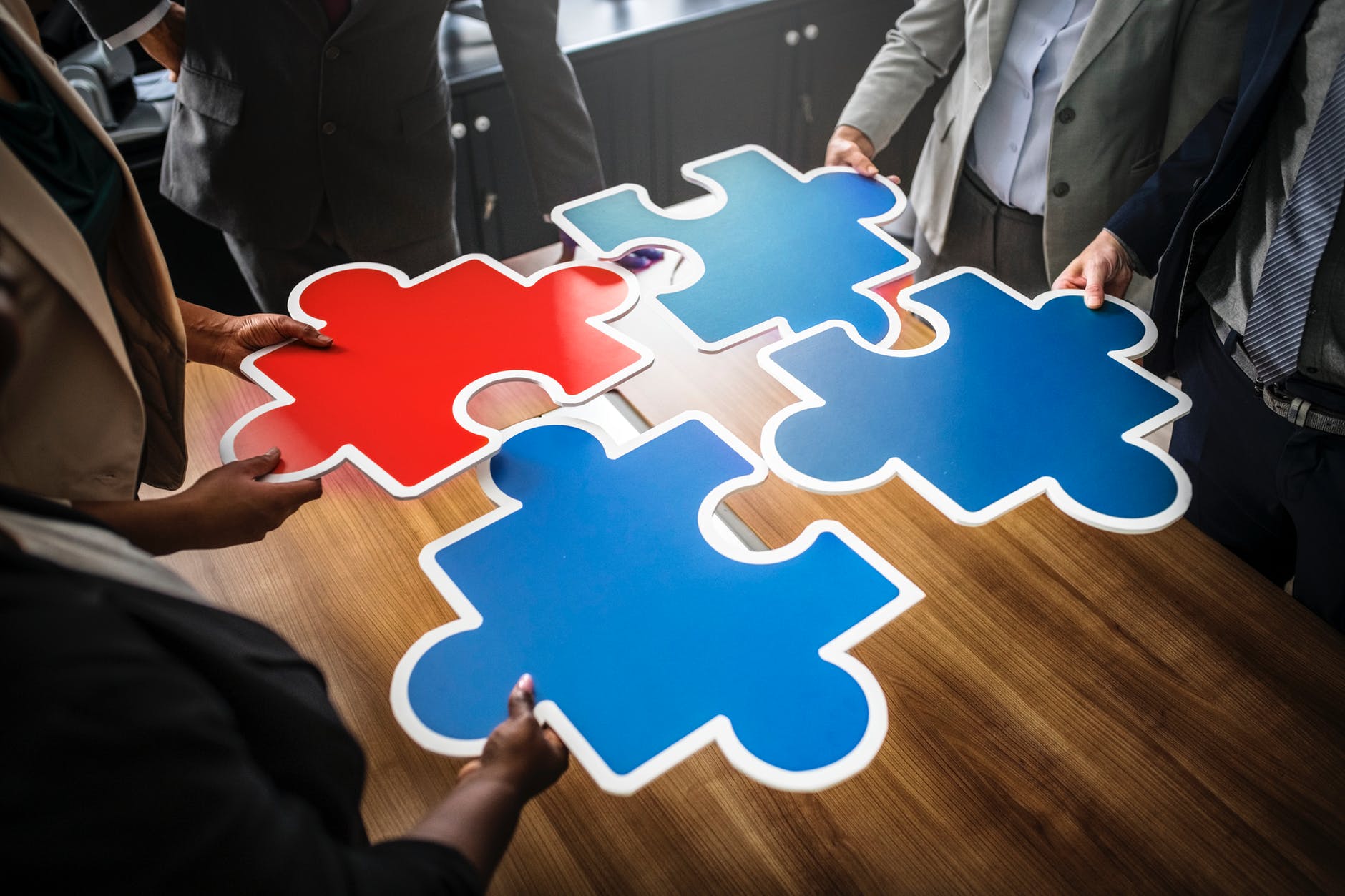 red and three blue jigsaw puzzles