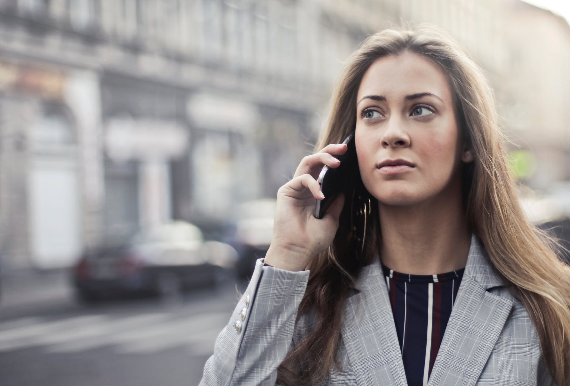 woman in grey notched lapel suit