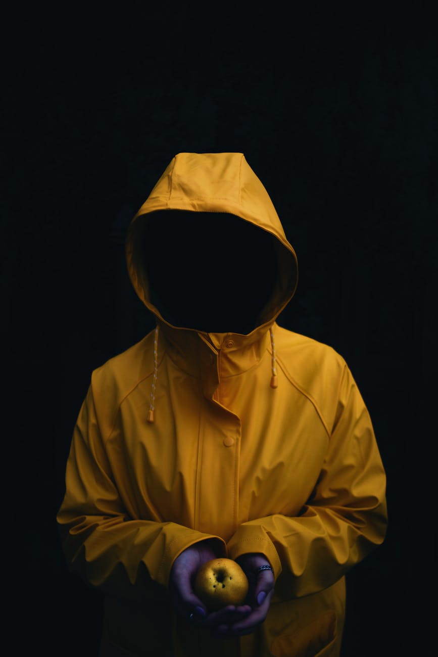 person wearing yellow hoodie