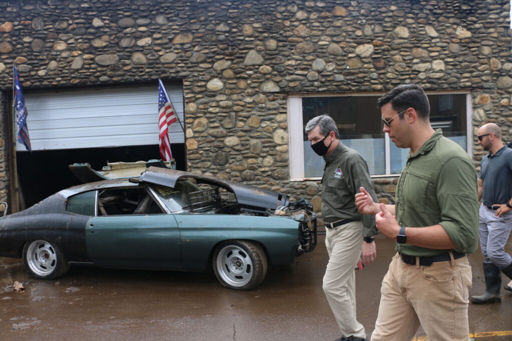 Canton Mayor Zeb Smathers and Gov. Roy Cooper walk through the town, which sustained serious property damage in Aug. 17 flooding. Credit to Mountaineer Publishing, Inc.