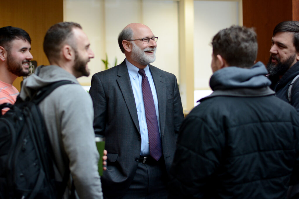 Dean Bierman enjoys an Elon Law coffee conversation in 2019.