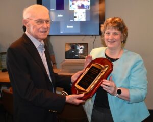 David Layton, left, accepts award from Nan Hannah, right.