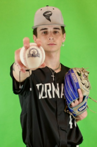 Andrew Weaver, a white young man with brown hair, wears a cap and black shirt. He holds a baseball in his right hand, outstretched to the camera, and a mitt in the other hand.