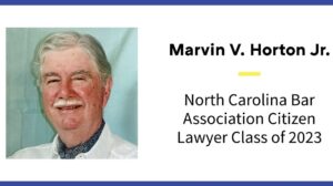A slide with Marvin V. Horton Jr.'s name appears. The slide reads, "North Carolina Bar Association Citizen Lawyer Class of 2023." His photo is on the slide, and he has white hair and a white beard and is wearing a white shirt and patterned blue scarf.