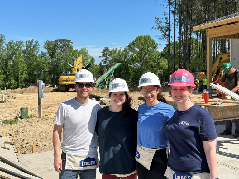 Nick Tosco with fellow ZPLU Section members in front of a Habitat for Humanity site.